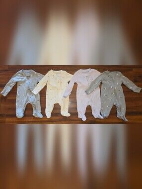 (4) Carter's One-Piece Footies in Yellow/Cream, Light Purple And Gray Size NB